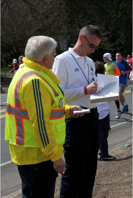 tim carter w3atb talking with paramedic leader mike tryon at first aid station #12 boston marathon