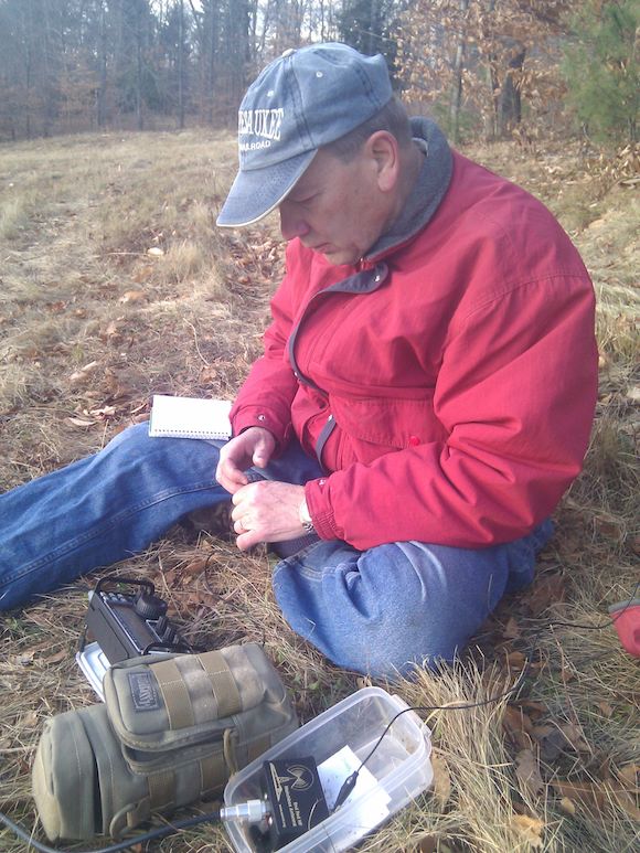 Here's Jim operating a tiny iambic paddle to send the characteristic di's and dah's that are part of a CW signal. Photo credit: Tim Carter, W3ATB
