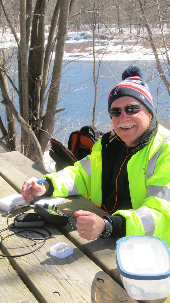 That's me! I've got a smile on my face because of the weather, the company and I just completed my first outdoor QSO next to the Pemi! Photo credit: Jim Cluett, W1PID
