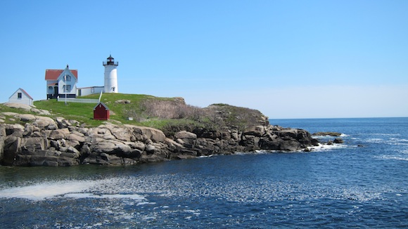 This is the famous Nubble Lighthouse in Maine. You're 2/3rds of the way to Ongunquit, ME from Portsmouth, NH when you stop here for water. This photo was taken in May, 2012. In 2014, the fog was so thick you could barely see the lighthouse from shore. Photo credit: Tim Carter - W3ATB