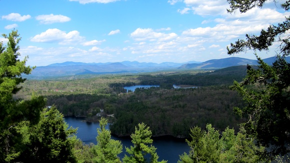 This is a view looking north northeast from the end of the Bald Ledge trail above Sky Pond, NH. Lake Winona is in the foreground and you're looking out at the Squam Mountain range with Mt. Morgan the highest peak towards the left. Photo credit: Tim Carter - W3ATB