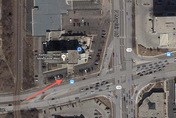 The red arrow points to where I was set up. It was a very steep small section of grass between the hotel parking lot and the busy street.