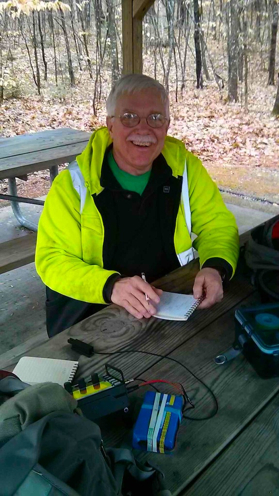 Here I am happy to be using an Elecraft KX3 and staying warm with our Little Buddy heater under the table. Photo credit: Jim Cluett